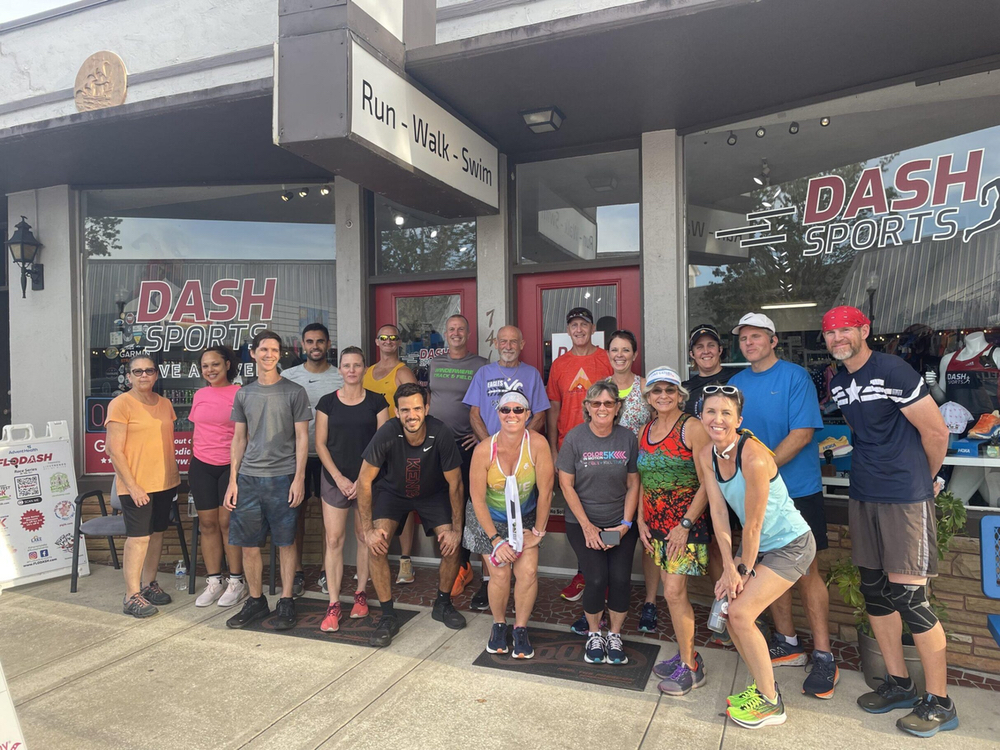 Dash Sports staff and runners gathered outside the Clermont, FL store before a social run