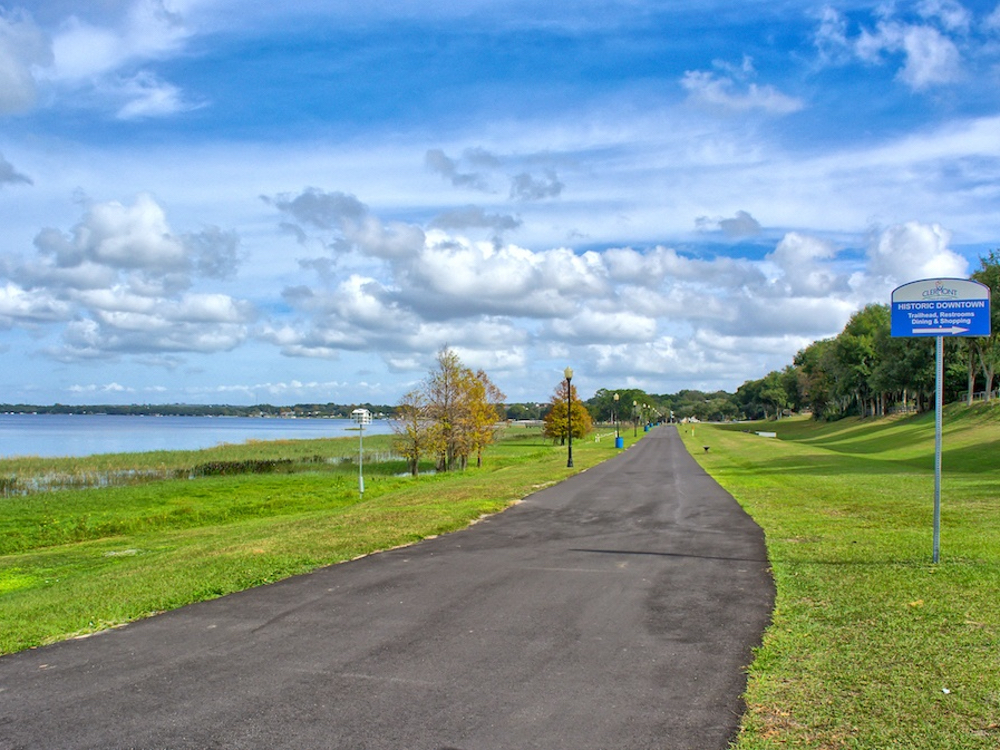 Paved South Lake Trail running path along Lake Minneola at Clermont Waterfront Park in Clermont, FL